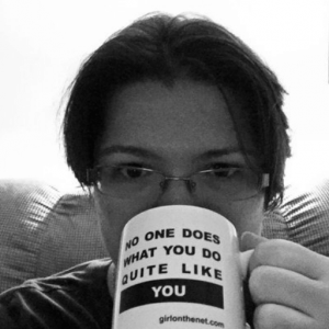 Kayla Lords drinking from mug that says No one does what you do quite like you